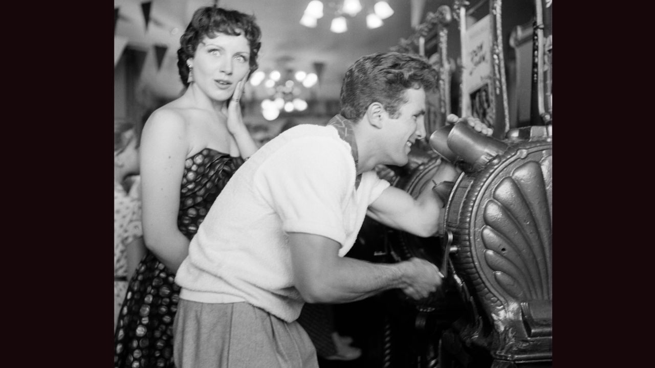 Actors Steve Rowland and Kathleen Case posed as they viewed arcade movies on opening day. Frank Sinatra, Sammy Davis Jr., Debbie Reynolds and Eddie Fisher were among the other big name guests at the park. 