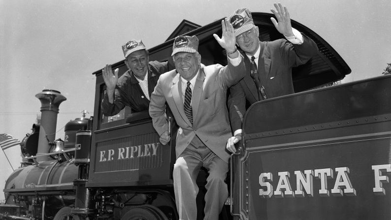 Disney, left, was a devoted fan of model railroads and trains. Here he's shown with California Gov. Goodwin J. Knight, center, and Fred G. Gurley, president of Santa Fe Railroad, right, on board the cab of an old-time railroad engine getting ready to take a ride around the park. The Santa Fe Railroad was an investor in the park.