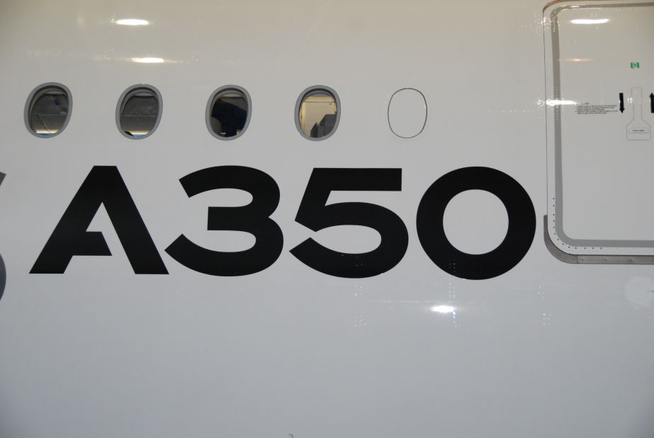 The A350's fuselage is mostly made of strong, lightweight carbon fiber reinforced plastic. This material allowed engineers to design larger windows that offer passengers more panoramic views.