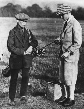 A young King Edward VIII (right) seen here in 1916. Then the Prince of Wales, he was a golf lover and wore "typical golfing dress rather than royal wear," Fleming says. His relaxed choice of clothing extended to wearing Fair Isle sweaters, which he helped popularize. The distinctive, multicolored weave is named after the small island in Shetland off Scotland's northeast coast.<br /><br />When Edward was appointed Captain of the Royal and Ancient Golf Club in 1922, a crowd of 6,000 onlookers watched him complete the "Drive into Office" (a ceremony on the first tee to mark the start of a new club captain's tenure) wearing a round-neck Fair Isle sweater.<br /> <br />"Knitwear became a look of its own and people would wear it outside the golf course -- thanks in part to Scottish knitwear companies like Pringle and Lyle and Scott," Fleming says.