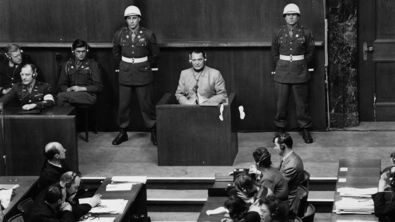 Nazi leader Hermann Goering sits in the witness box at the Nuremberg War Crime Trials, where he was later sentenced to death, in 1946.