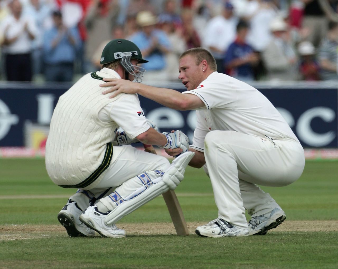Friends after the battle: England all-rounder Flintoff consoles Lee after Australia lost the Second Ashes Test match by just two runs in 2005.