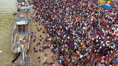 Thousands of people gather during a Hindu religious bathing festival on the bank of the Godavari River in the Andhra Pradesh state on July 14.