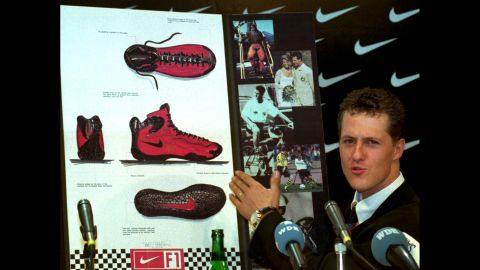 Formula One champion Michael Schumacher presents his new Nike racing shoe in Cologne, Germany, in January 1996. Throughout its history, Nike has signed endorsement deals with some of the biggest names in sports, including Schumacher, Tiger Woods, Roger Federer and LeBron James.
