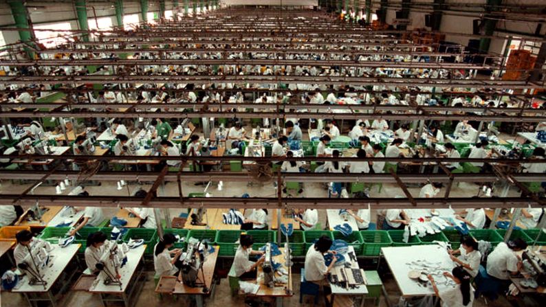 Workers in Ho Chi Minh City, Vietnam, stitch Nike shoes in July 1997. In response to allegations of child labor in its overseas factories, Nike promised to improve working conditions and raise minimum ages. "The Nike product has become synonymous with slave wages, forced overtime, and arbitrary abuse," <a href="index.php?page=&url=http%3A%2F%2Fwww.nytimes.com%2F1998%2F05%2F13%2Fbusiness%2Finternational-business-nike-pledges-to-end-child-labor-and-apply-us-rules-abroad.html" target="_blank" target="_blank">Knight said when announcing the changes in May 1998.</a> "I truly believe the American consumer doesn't want to buy products made under abusive conditions."