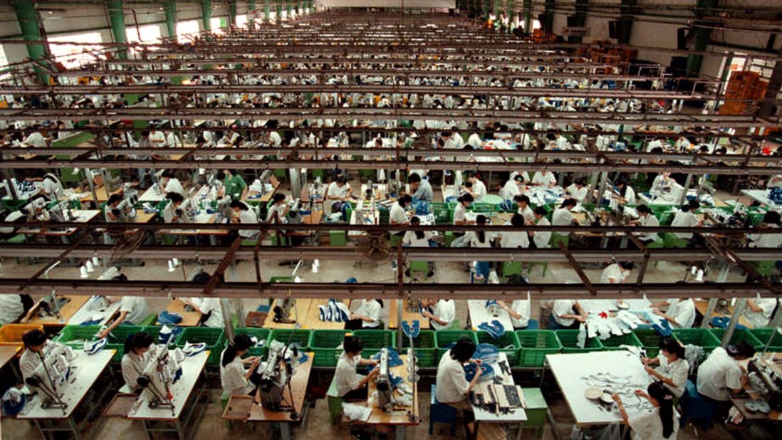 Workers in Ho Chi Minh City, Vietnam, stitch Nike shoes in July 1997. In response to allegations of child labor in its overseas factories, Nike promised to improve working conditions and raise minimum ages. "The Nike product has become synonymous with slave wages, forced overtime, and arbitrary abuse," <a href="http://www.nytimes.com/1998/05/13/business/international-business-nike-pledges-to-end-child-labor-and-apply-us-rules-abroad.html" target="_blank" target="_blank">Knight said when announcing the changes in May 1998.</a> "I truly believe the American consumer doesn't want to buy products made under abusive conditions."