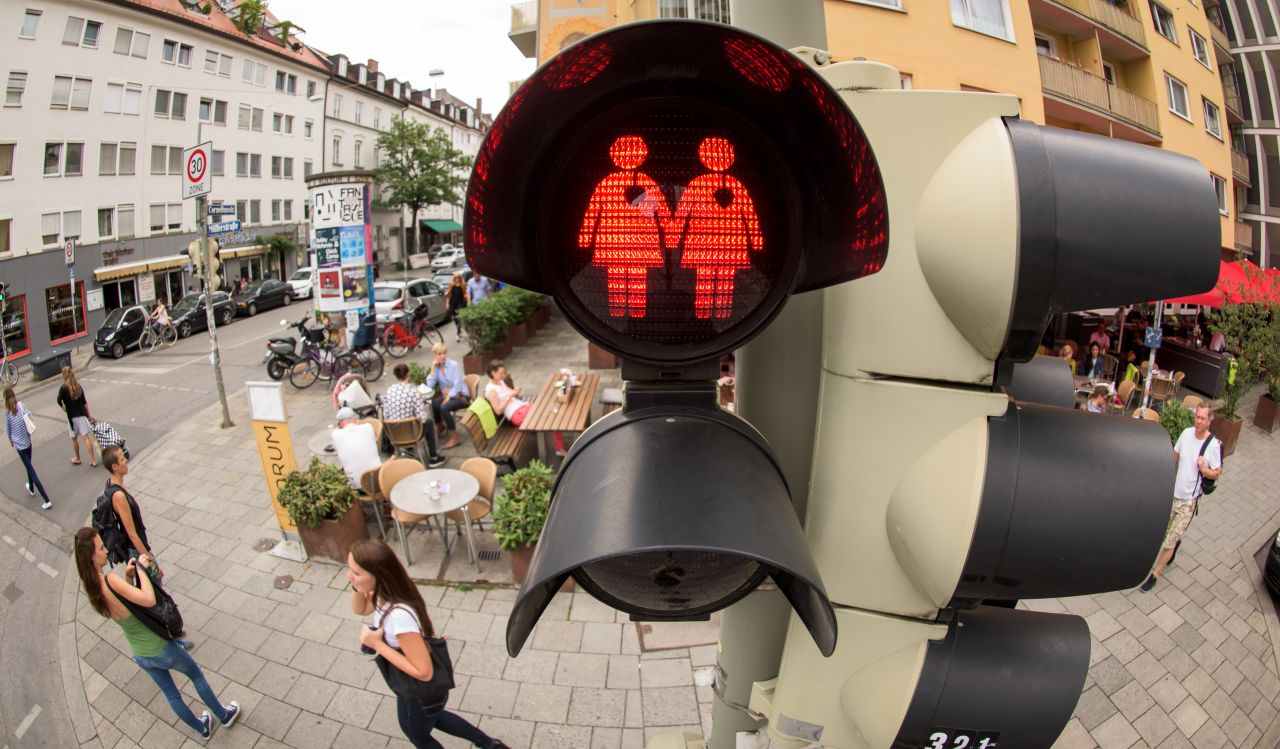 A pedestrian crossing signal shows a lesbian couple at a junction in Munich, Germany on July 14, 2015. The city, taking a cue from a similar project in Vienna, introduced the new signals at a limited number of traffic lights downtown for the recent LBGT pride festival, also known as Christopher Street Day, named after the location of the Stonewall Inn in New York, and has since decided to keep them.