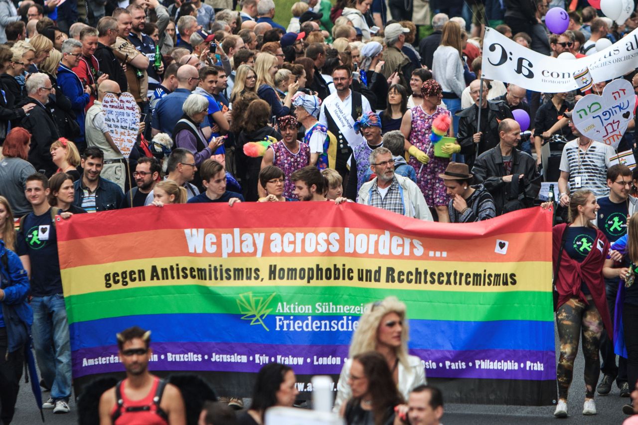 Participants show a banner with rainbow colors as they attend the Christopher Street Day parade in Berlin, Germany on June 27.