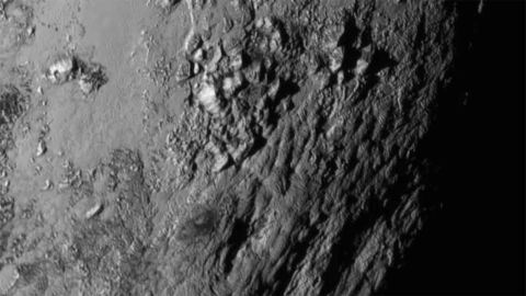 Close-up images of a region near Pluto's equator revealed a giant surprise: a range of youthful mountains. NASA released the image on July 15.