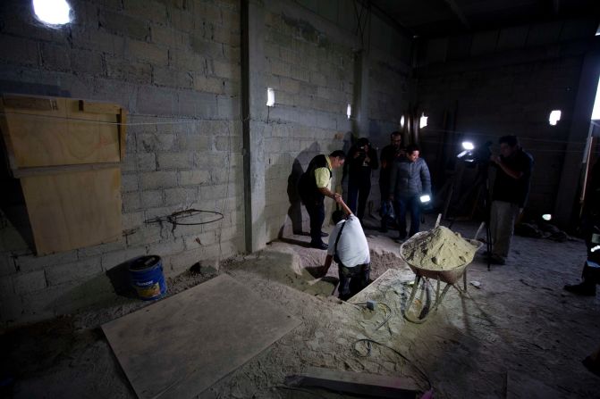 Journalists exit the tunnel on Tuesday, July 14.