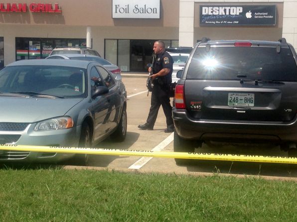 An officer patrols the parking lot of the recruitment center.