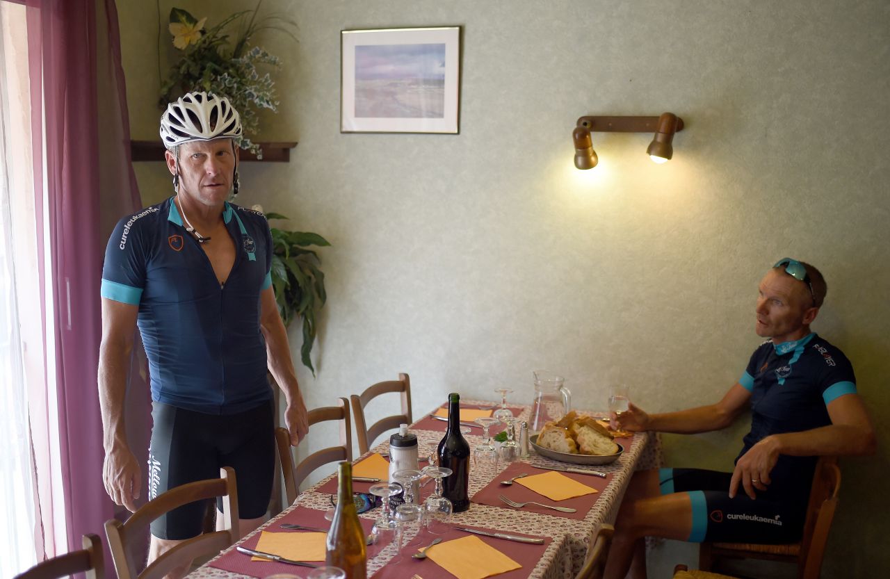 Armstrong (left) agreed to take part for the charity ride organized by former English soccer player Geoff Thomas (right). They had lunch in the village of Villefranche d'Albigeois, southwest France.