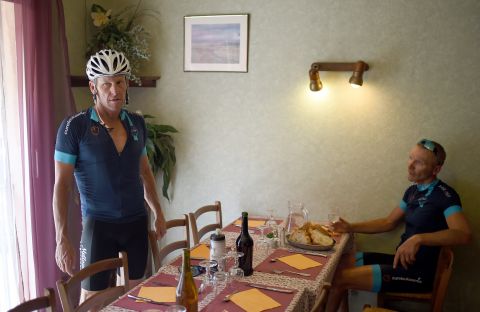 Armstrong (left) agreed to take part for the charity ride organized by former English soccer player Geoff Thomas (right). They had lunch in the village of Villefranche d'Albigeois, southwest France.