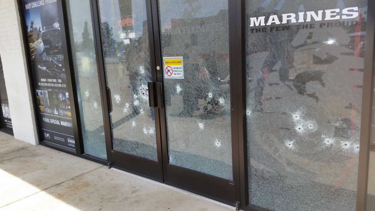 The entrance to the military recruiting office off Lee Highway in Chattanooga, Tennessee, is seen riddled with bullet holes. 