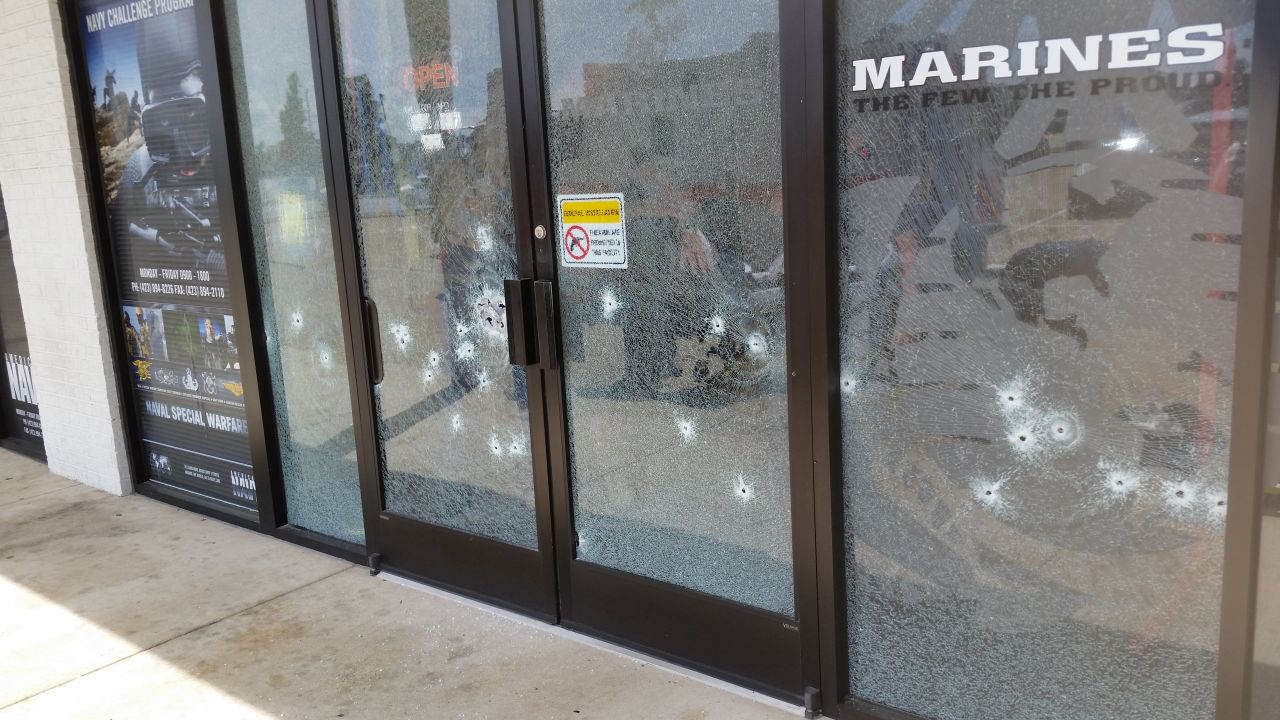 The entrance to the military recruiting office off Lee Highway in Chattanooga, Tennessee, is seen riddled with bullet holes.