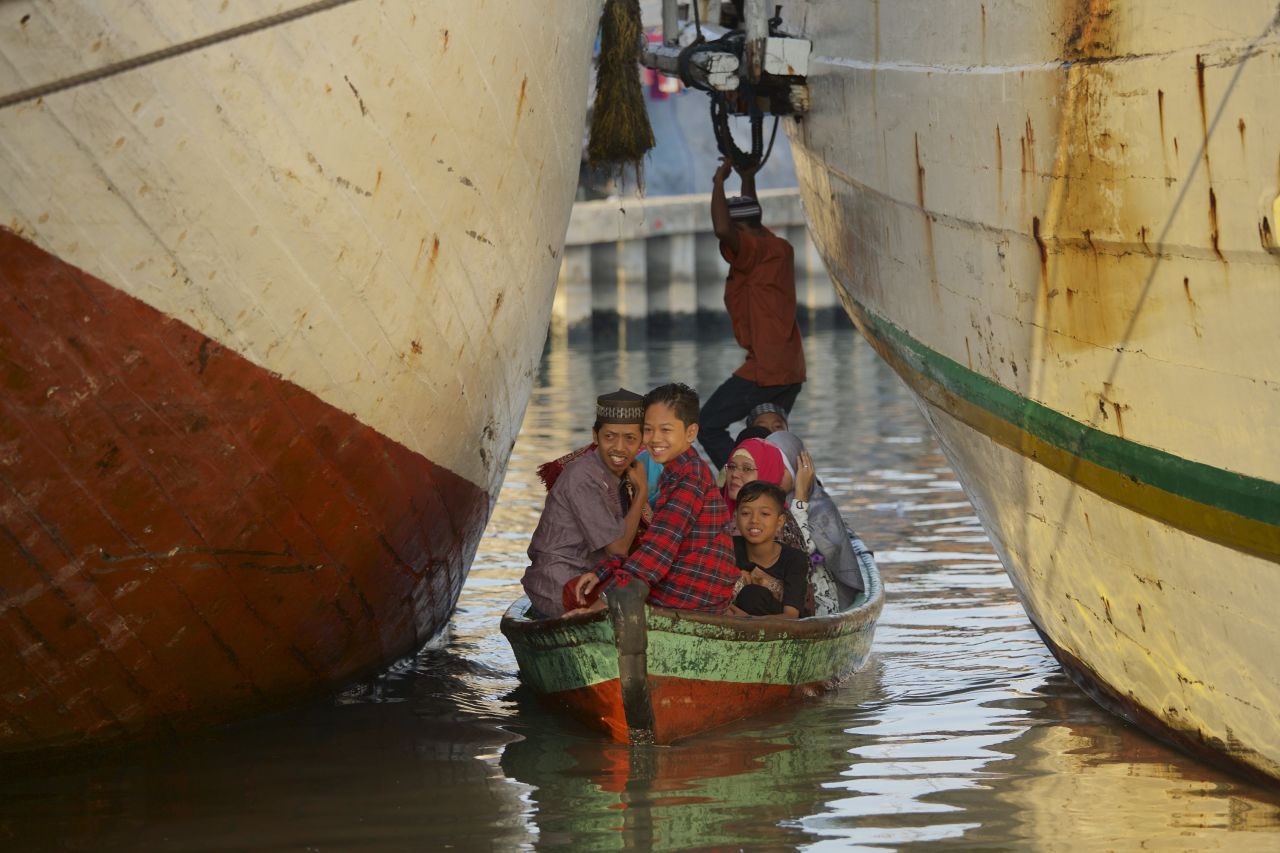 Indonesians arrive by boat for Eid prayers at the Sunda Kelapa port in Jakarta.