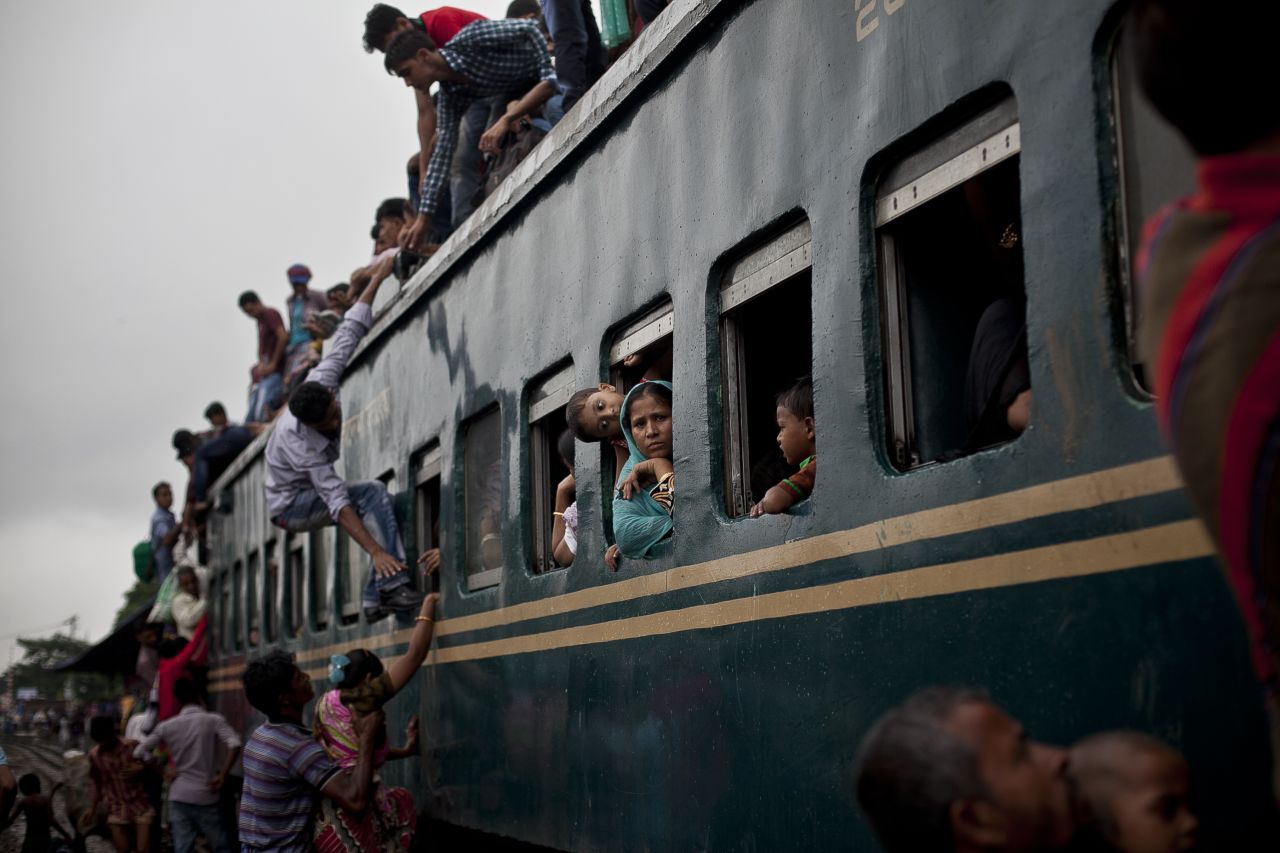 Muslims crowd onto a train to head home to their respective villages ahead of Eid in Dhaka, Bangladesh.