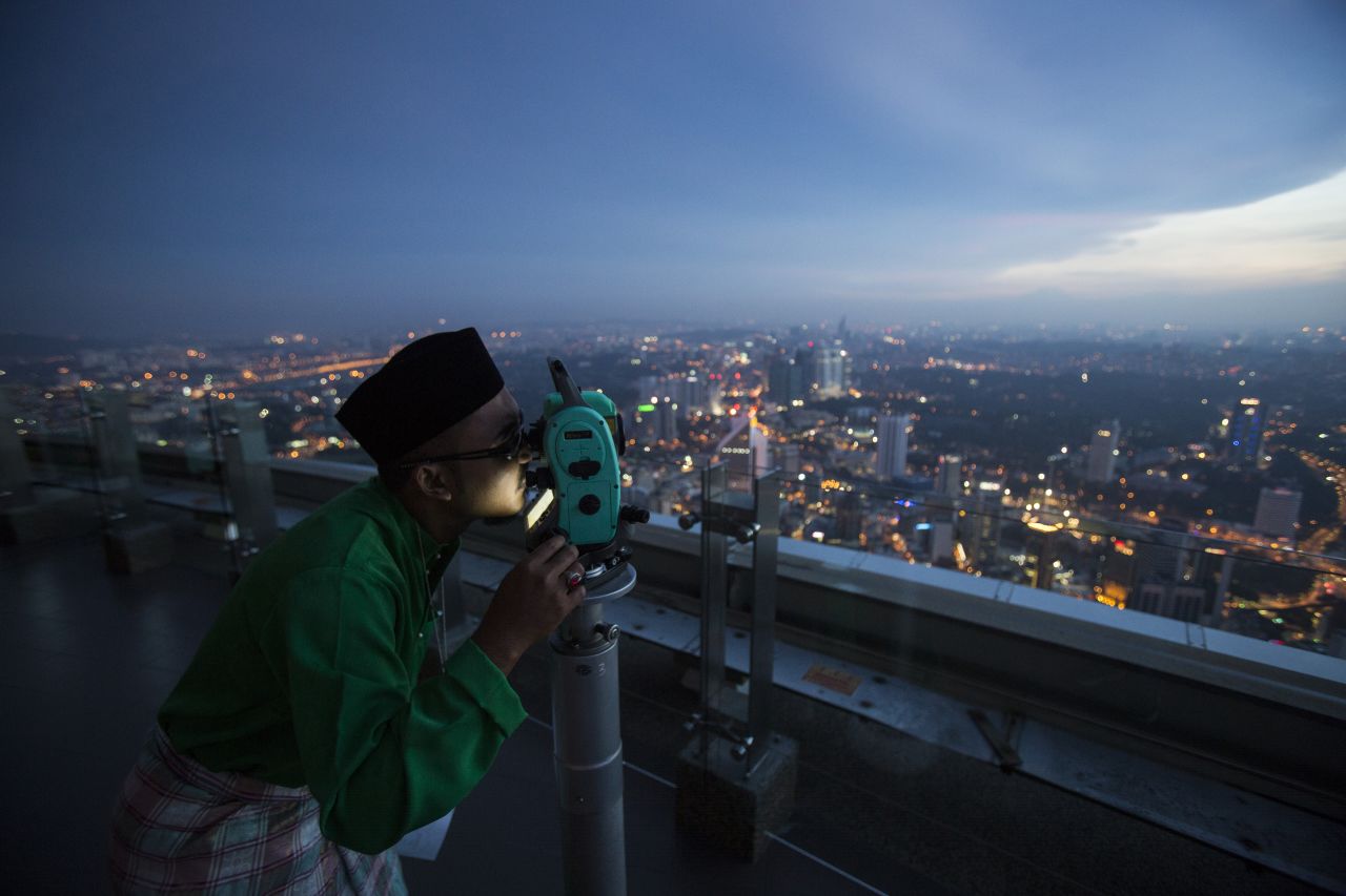 A Malaysian Islamic authority performs the "Rukyah Hilal Syawal," the sighting of the new moon, to determine the Eid Al-Fitr celebrations in Kuala Lumpur, Malaysia, Thursday, July 16.