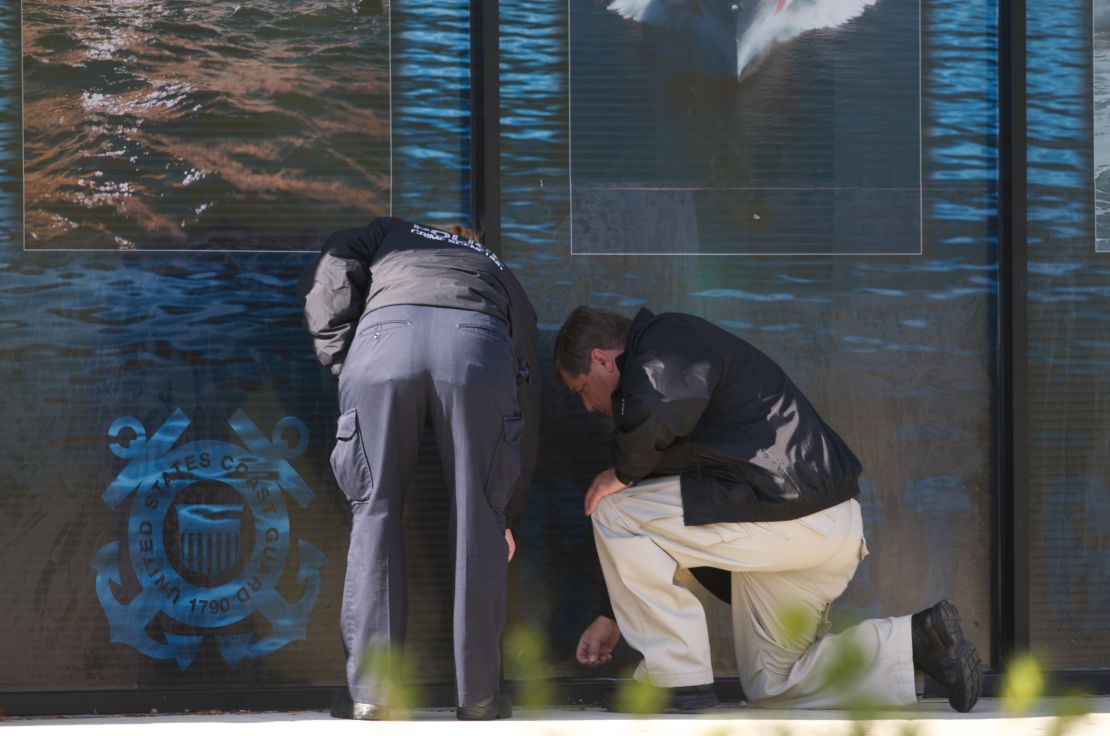 Investigators at the scene of a 2010 shooting.