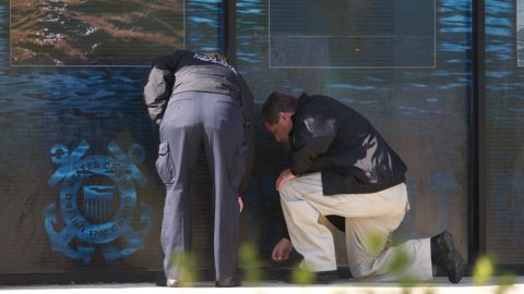 Investigators at the scene of a 2010 shooting.