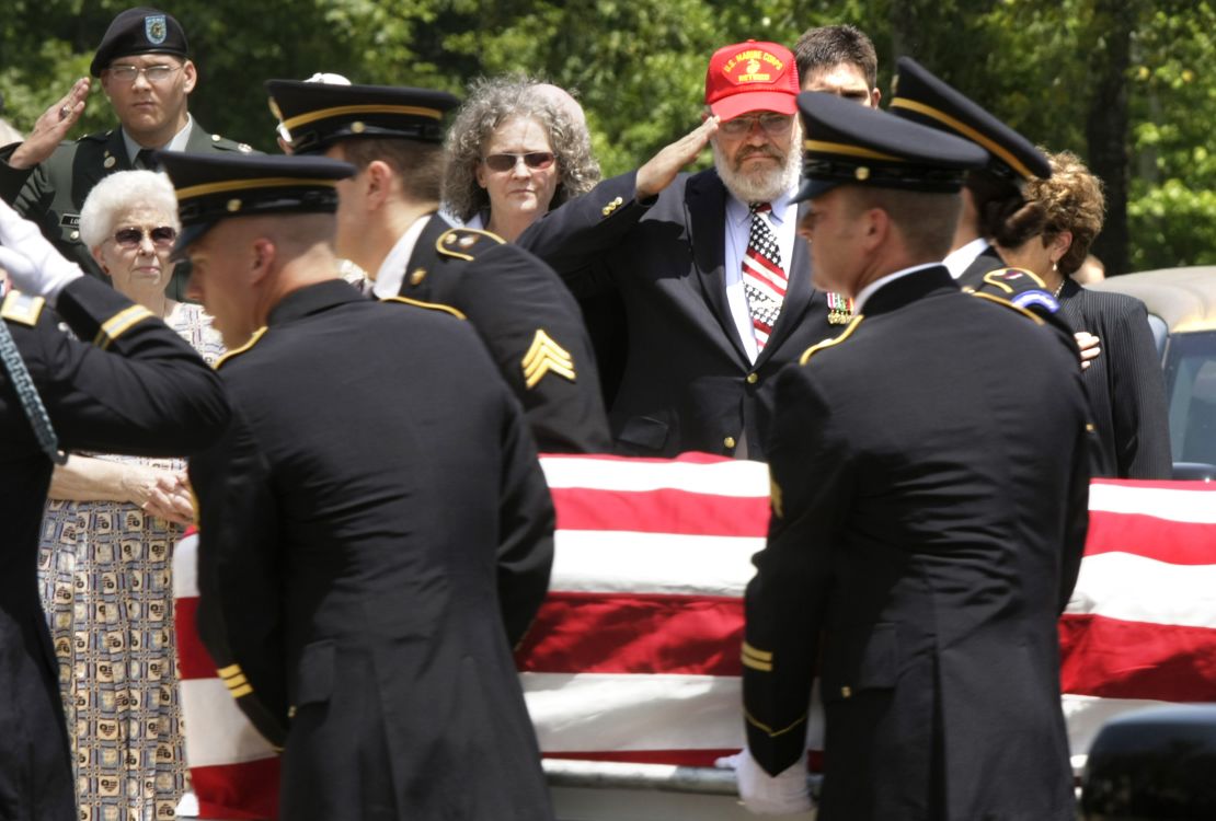 Daris Long salutes the casket of his son.