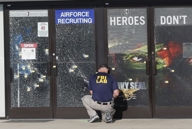 An FBI investigator works outside a military recruiting center where a gunman opened fire Thursday, July 16, in Chattanooga, Tennessee. Authorities say Mohammad Youssuf Abdulazeez, 24, opened fire first on the recruiting station and then moved to a U.S. Navy facility seven miles away. At the Navy facility, he fatally shot four U.S. Marines and wounded three other people before he died in police gunfire. A U.S. Navy sailor later died from his wounds.