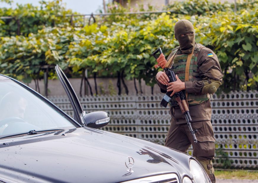 Ukrainian security forces on the lookout in Bobrovyshche on July 14.  The country's troops face daily attacks from Russian-backed separatists despite a ceasefire being in place.