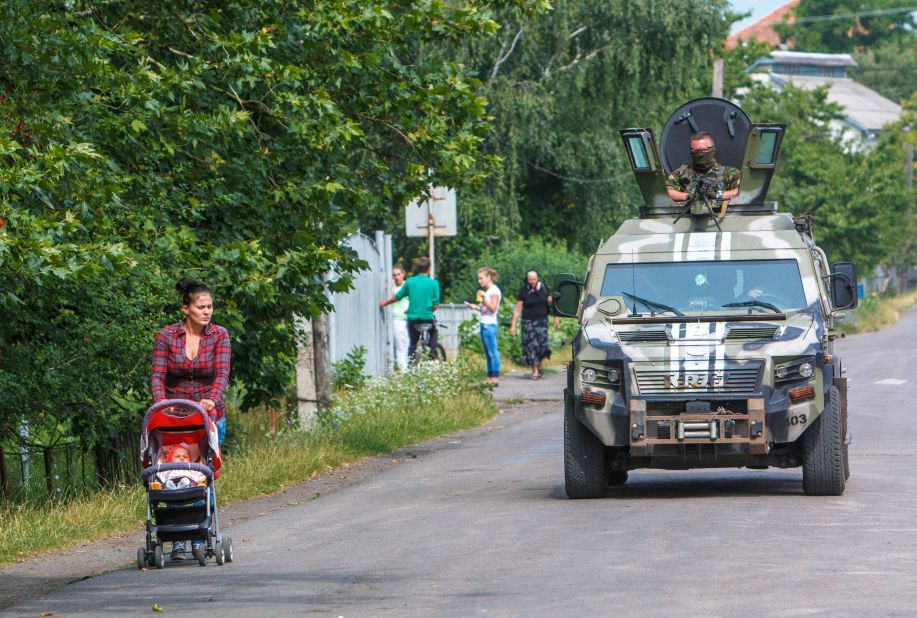 Ukrainian security forces patrol in the village of Bobrovyshche on July 14, 2015. More than 6,400 people have been killed in the conflict in Ukraine since April 2014, the United Nations says.
