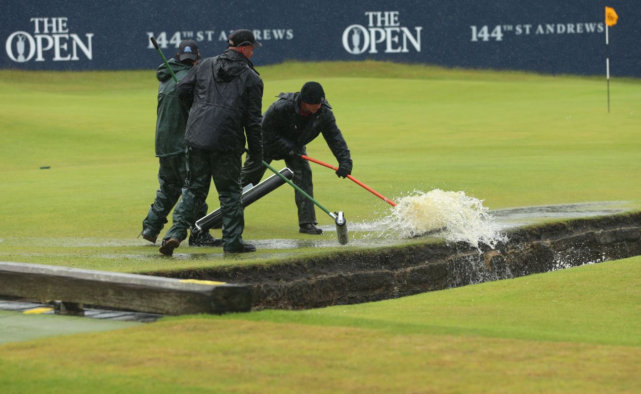 Happily there was somewhere for all the water to go as green staff armed with squeegees brush the puddles into the famous Swilcan Burn. 