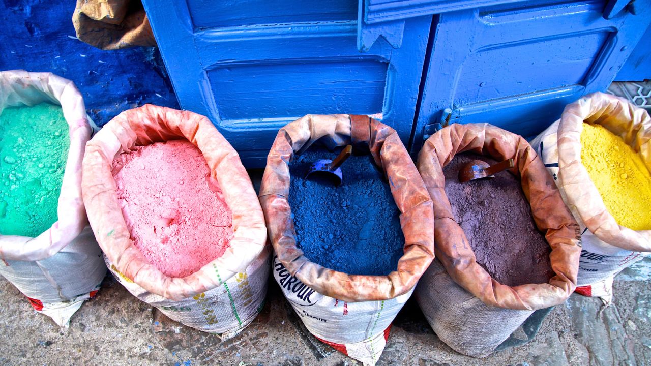 The entire city needs a fresh coat of blue paint every two years. It's done in stages -- a never-ending chore accomplished with powdered pigment like these. The bags are a common sight outside shops around the city. The pigment is mixed with water and is often applied with a traditional brush made of dried grass tied in a bundle. 