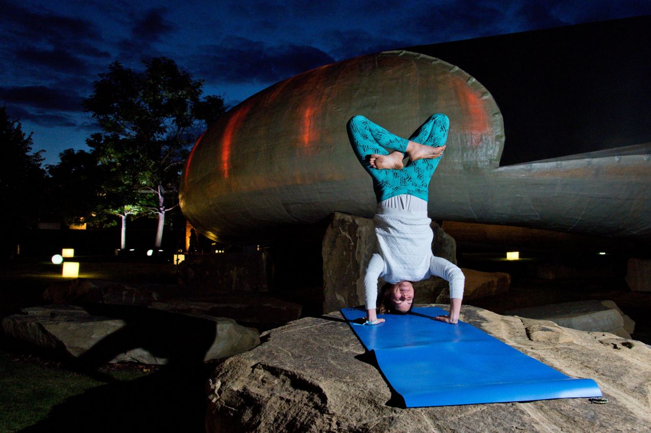"The big things that all teachers hate are lateness, leaving early, and doing your own practice, " says yoga instructor Mariza Smith. "(Yogis) will kind of rock up and do their own thing." This yogi is seen practicing a headstand at an outdoor yoga class at London's Serpentine Pavilion in August 2014.
