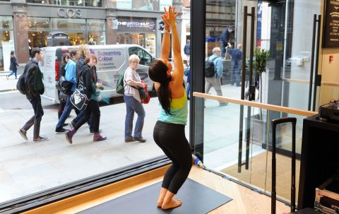 A "yoga strutter" who likes to be seen wearing the latest gear, is often dressed head to toe in Lululemon, says Smith. This practitioner poses at a class at the yoga retailer's Covent Garden branch in London. 