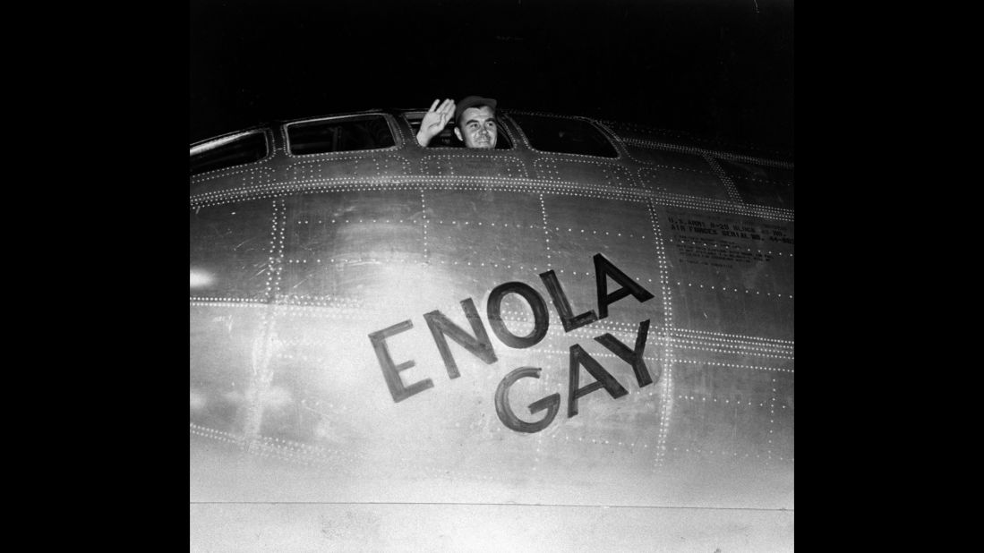 Air Force Col. Paul Tibbetts waves from the pilot's seat of the Enola Gay moments before takeoff on August 6, 1945. A short time later, the plane's crew dropped the first atomic bomb in combat, instantly killing 80,000 people in Hiroshima.