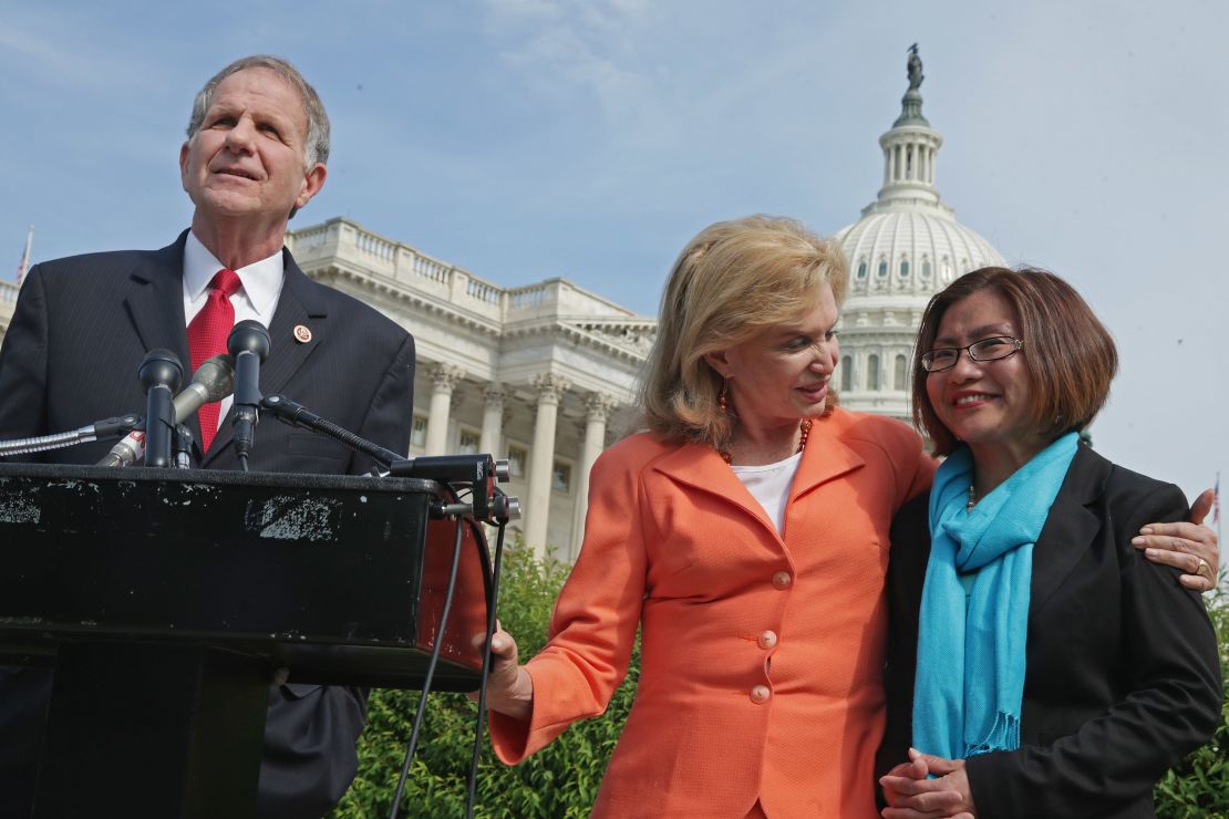 Human trafficking survivor and activist Shandra Woworunti, right, with Victims' Rights Representative Ted Poe and Representative Carolyn Maloney at a news conference at the U.S. Capitol last year. 