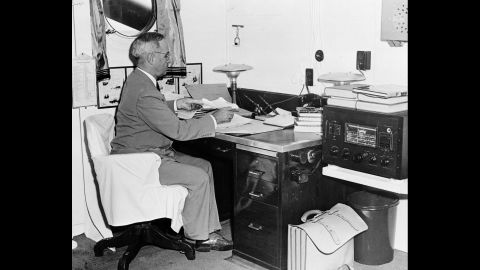 U.S. President Harry Truman, aboard a U.S. Navy cruiser, reads reports of the Hiroshima bombing. Eight days earlier, Truman had warned Japan that the country would be destroyed if it did not surrender unconditionally.