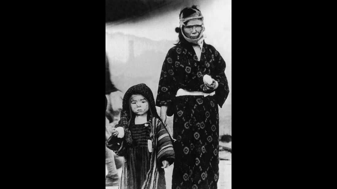 A woman and a child walk in Nagasaki on the day of the bombing. More than 70,000 people there were killed instantly.
