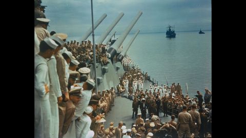 Soldiers and sailors on the USS Missouri watch as Japan's formal surrender is signed in Tokyo Bay on September 2, 1945.