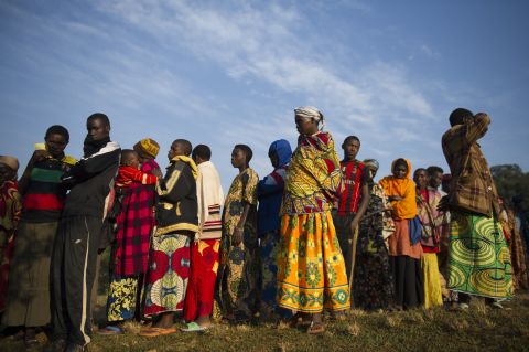 Residents line up before voting in the village of Buye on July 21.