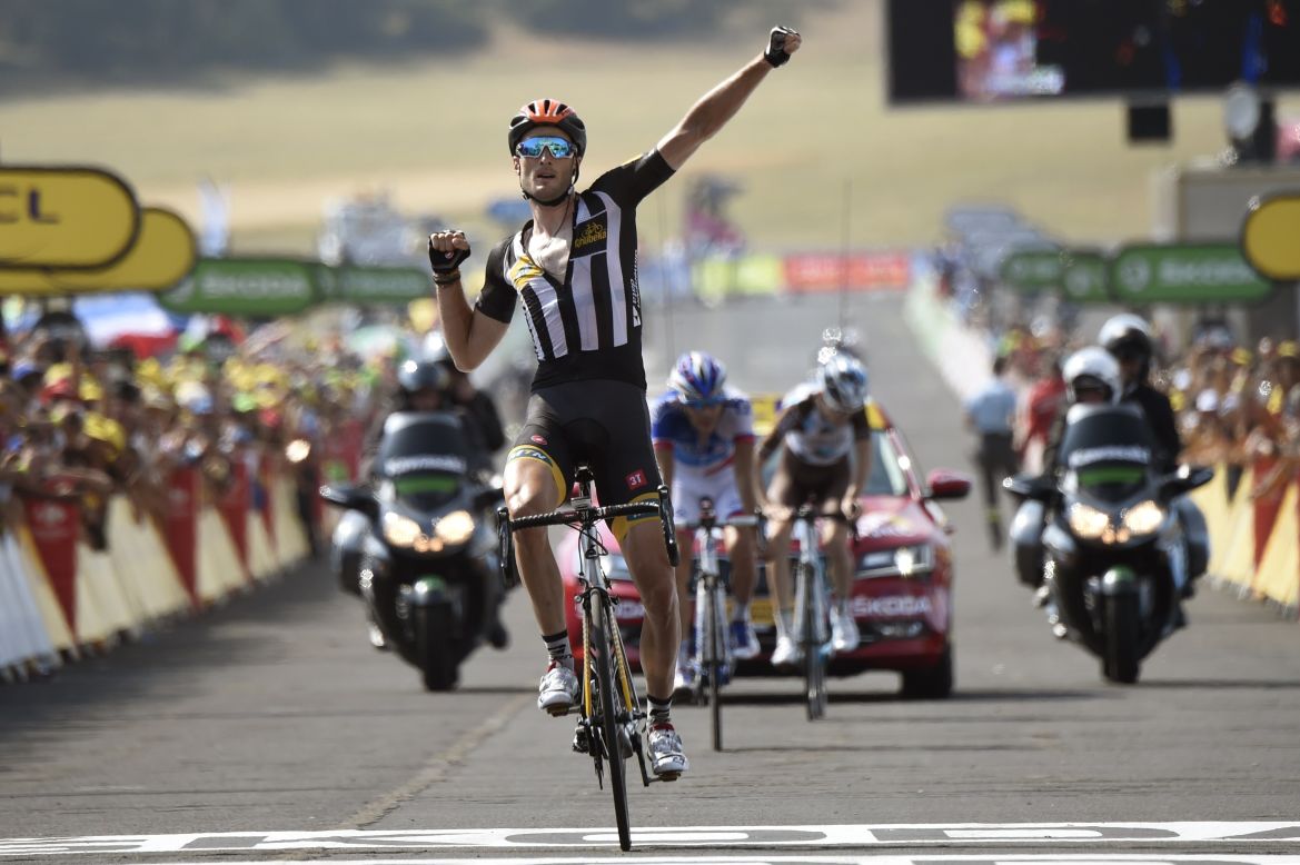 MTN-Qhubeka's Stephen Cummings celebrates as he crosses the finish line at the end of the 178,5 km 14th stage. It was the first Tour victory for an African team.