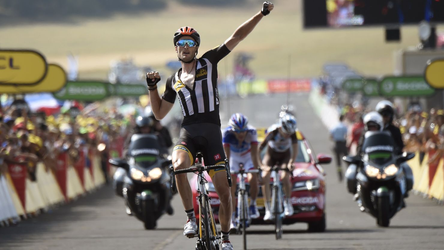 Steve Cummings celebrates as he crosses the finish line of the 14th stage of the 102nd Tour de France.