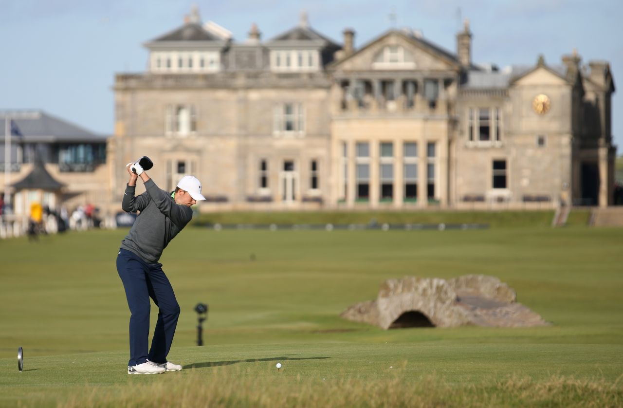 Spieth tees off on the 18th at the home of golf on his way to a par for a six-under 66.