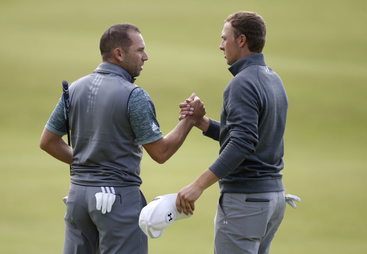 Spieth and playing partner Sergio Garcia of Spain shake hands after the finish of their rounds.