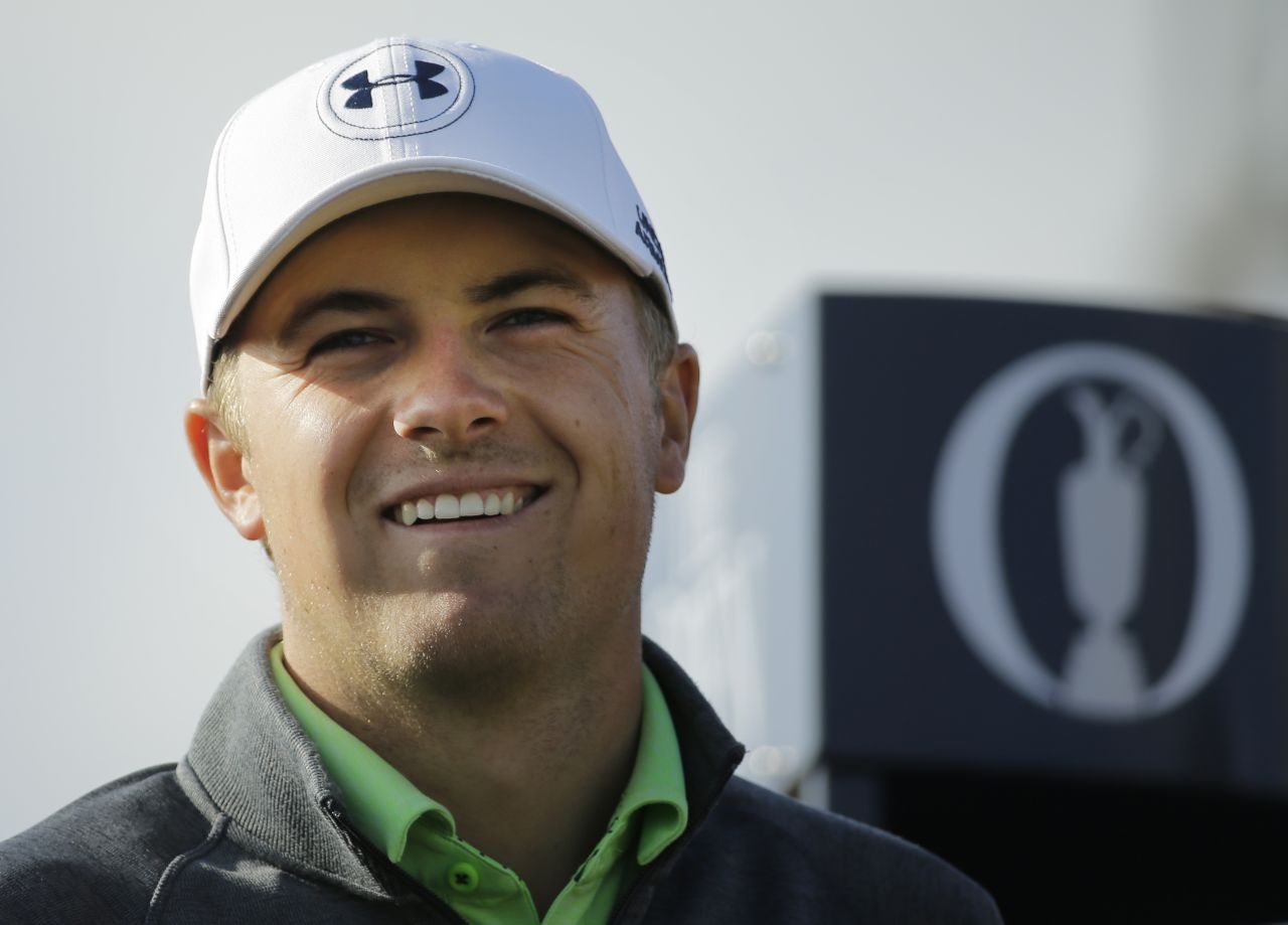 Jordan Spieth is all smiles after strengthening his bid for a third straight major victory by moving to 11-under-par at the British Open.