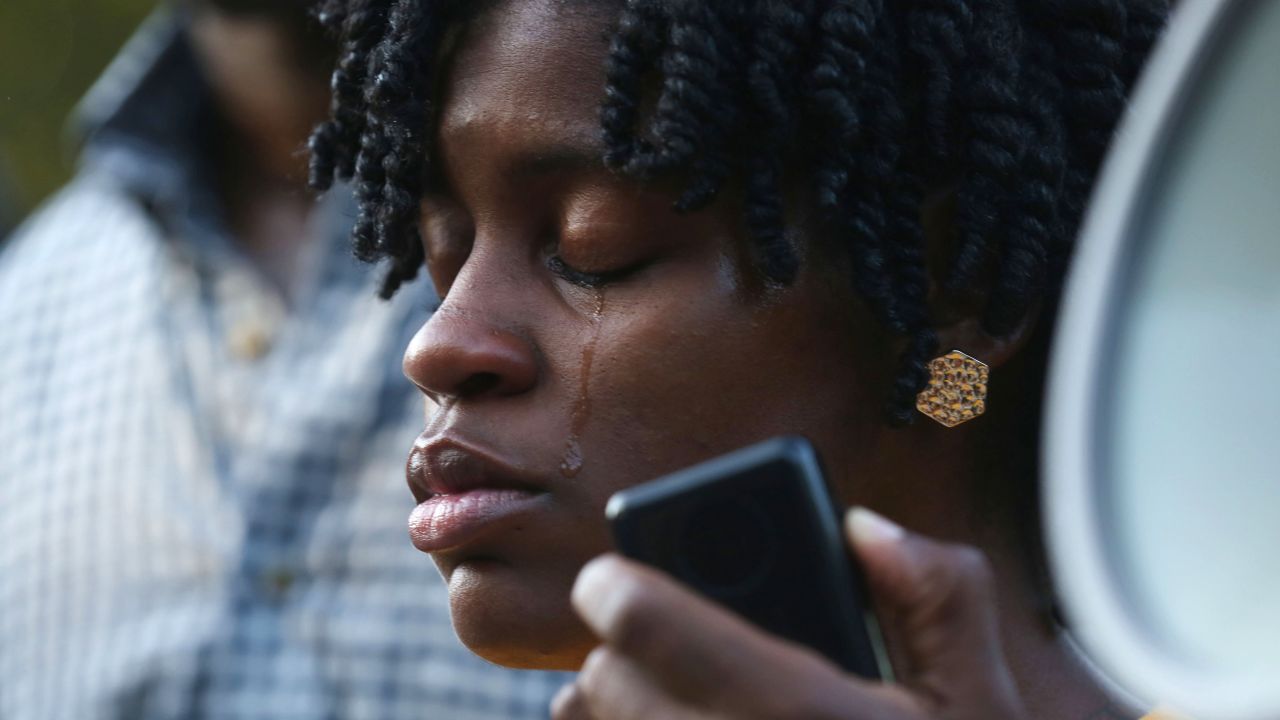 Angel Duncan cries Sunday, July 19, while speaking at a vigil at Bland's alma mater.