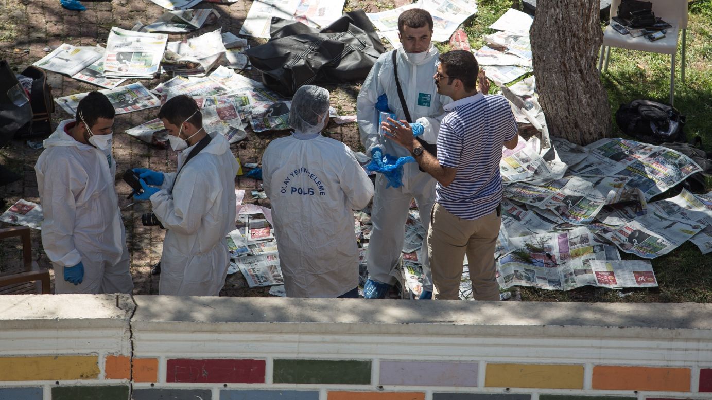 Police inspect the blast site on July 20. 