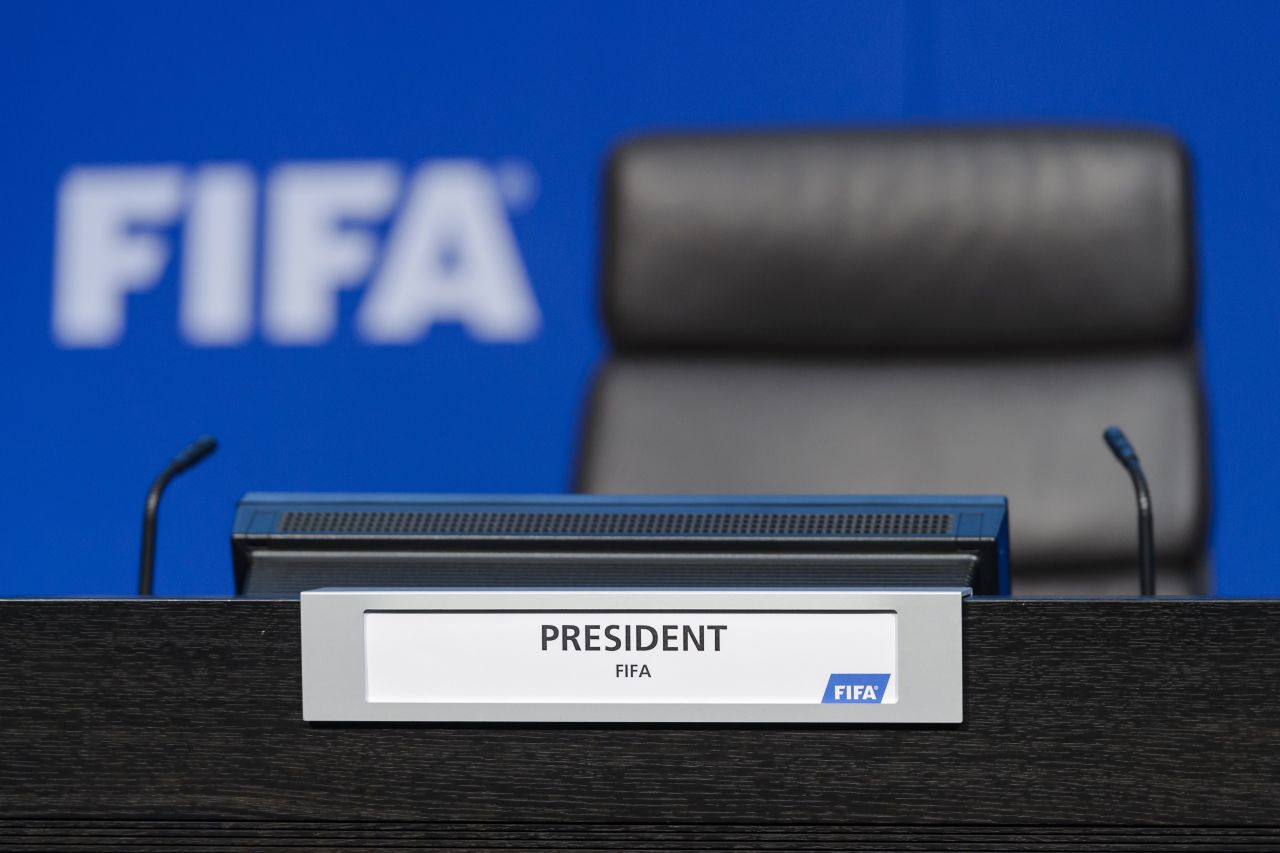 Before being ushered off the stage, Nelson showered Blatter with what appeared to be fake money.