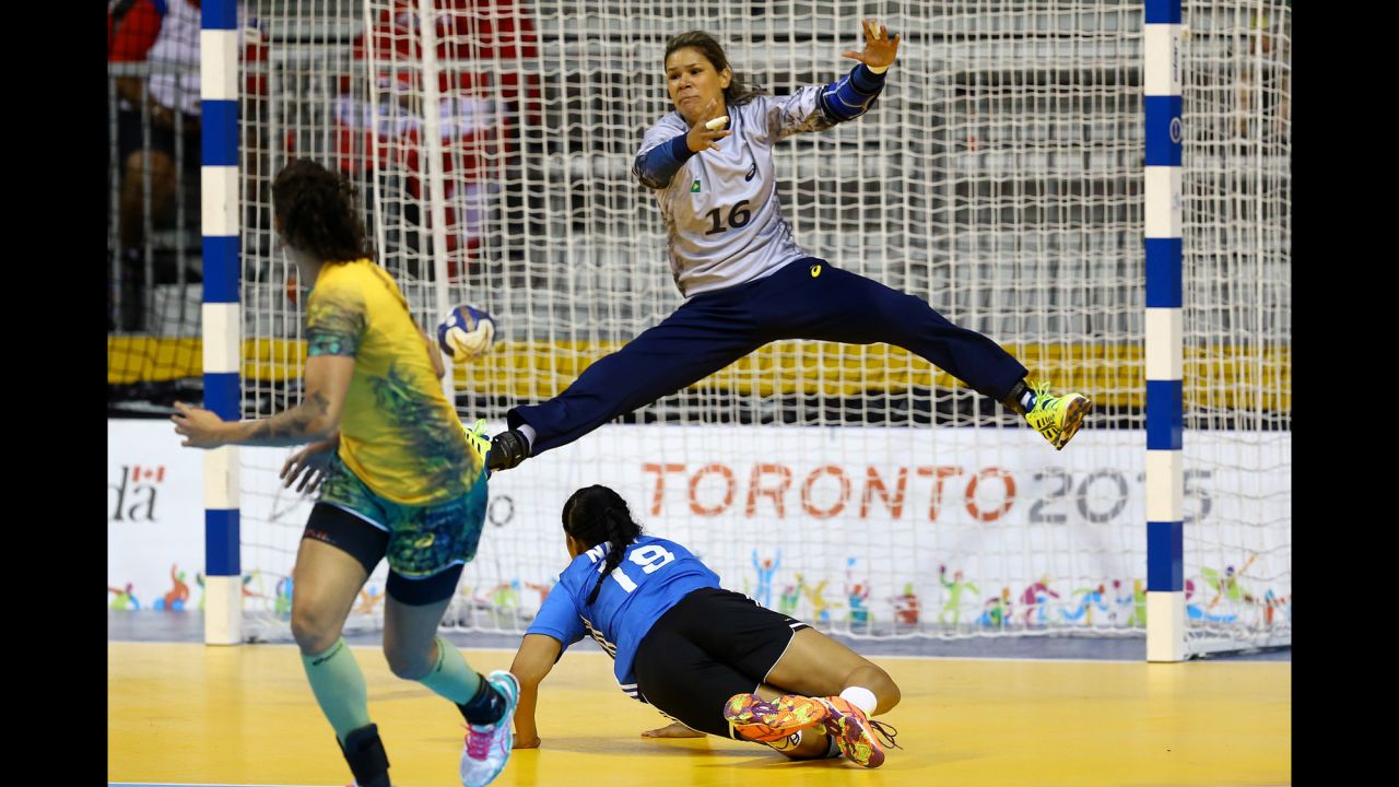 Mayssa Pessoa, goalkeeper for Brazil's handball team, stretches for a save while playing Puerto Rico in the Pan American Games on Thursday, July 16. Brazil won the match 38-21.