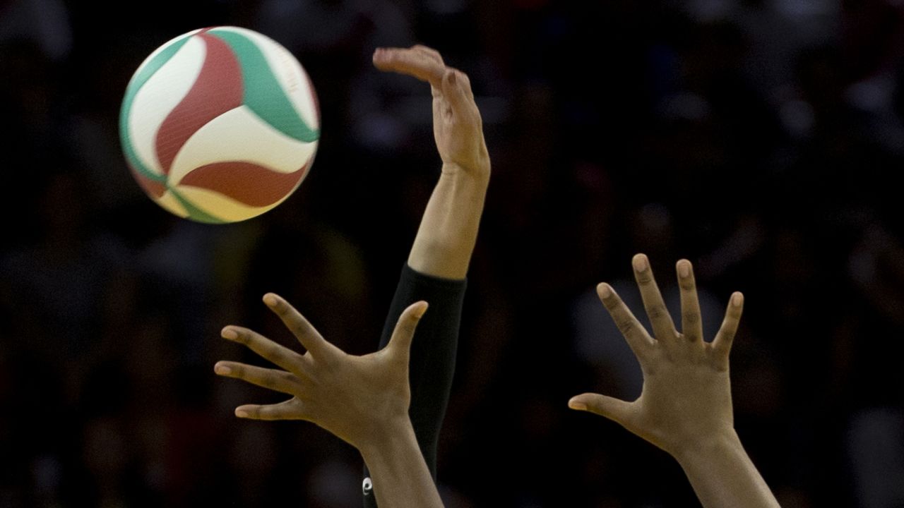 U.S. volleyball player Lauren Paolini curves her hand to spike the ball while playing Peru at the Pan American Games on Thursday, July 16.