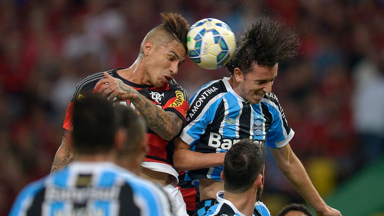 Flamengo's Paolo Guerrero, left, battles for the ball with Gremio's Geromel during a Brazilian league match in Rio de Janeiro on Saturday, July 18.