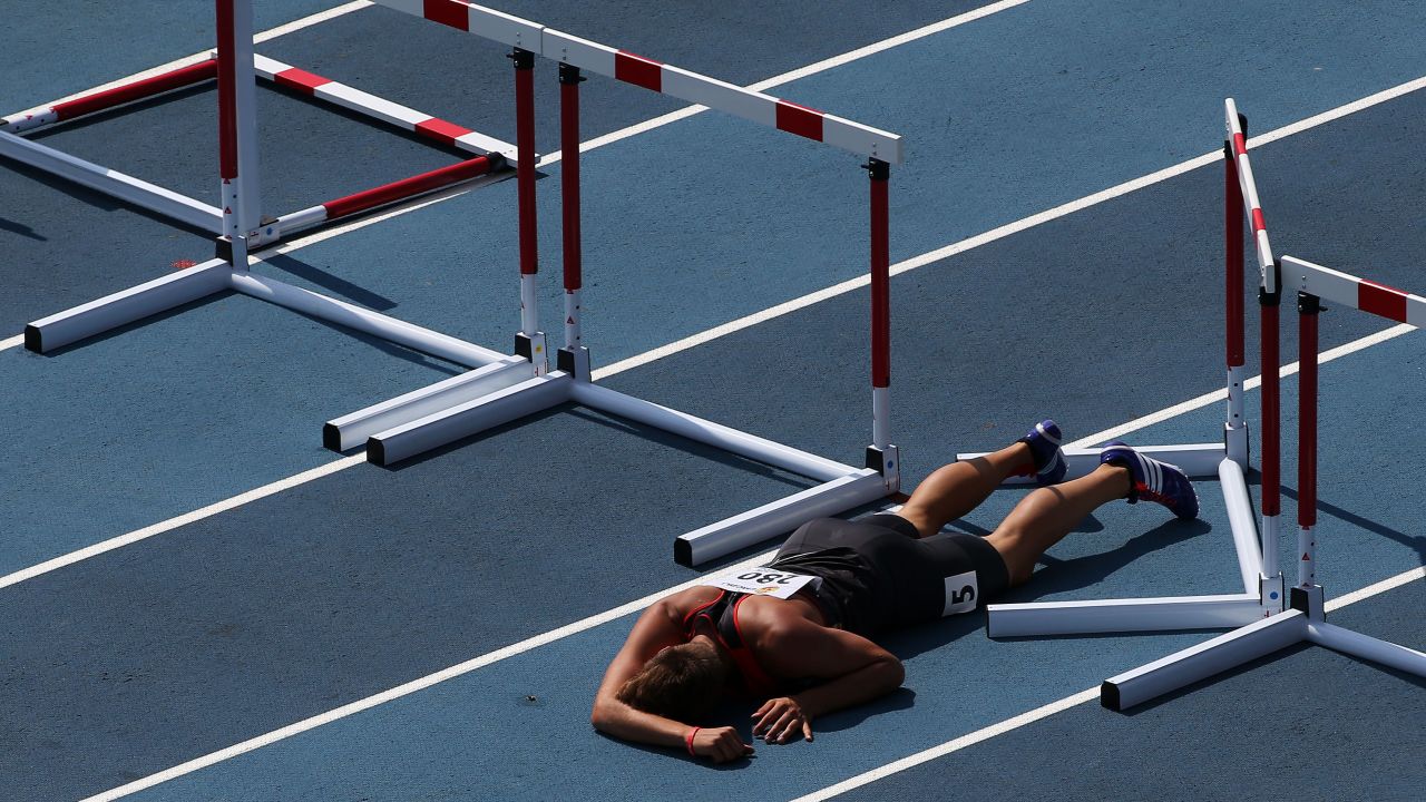 German decathlete Maximilian Vollmer lies on the ground after falling during the 110-meter hurdles Thursday, July 16, at the IAAF World Youth Championships in Cali, Colombia.